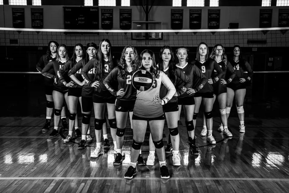 Black and white group photograph of a Seaway Smash volleyball team on court